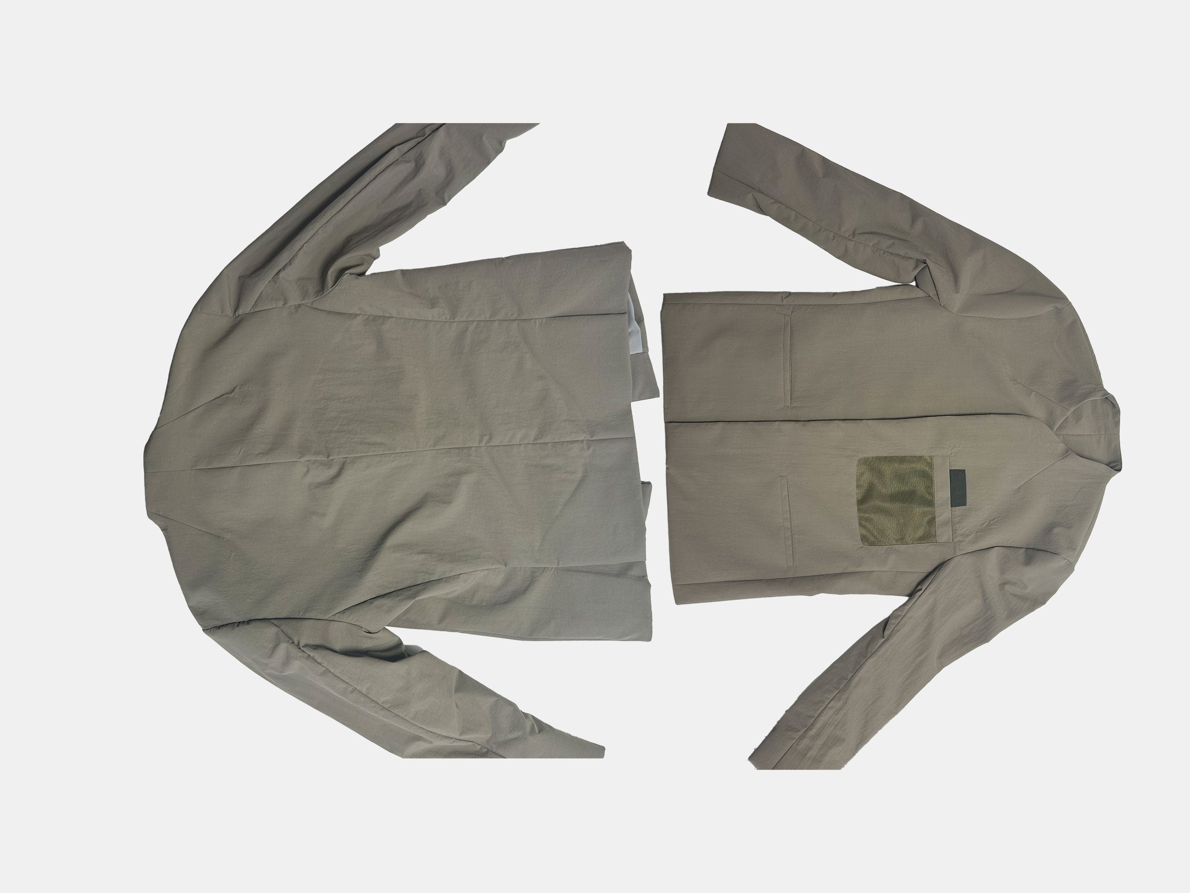 Two khaki blazers laid flat, one showing the back and the other showing the front. The left blazer displays a concealed pocket, while the right one highlights an olive green patch on the back. Both are on a white background.