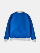 Displayed against a plain white background, the Blue Bomber Jacket by gabrielstunz features a vivid blue color with luxurious lining and contrasting white cuffs and collar, shown from the back.