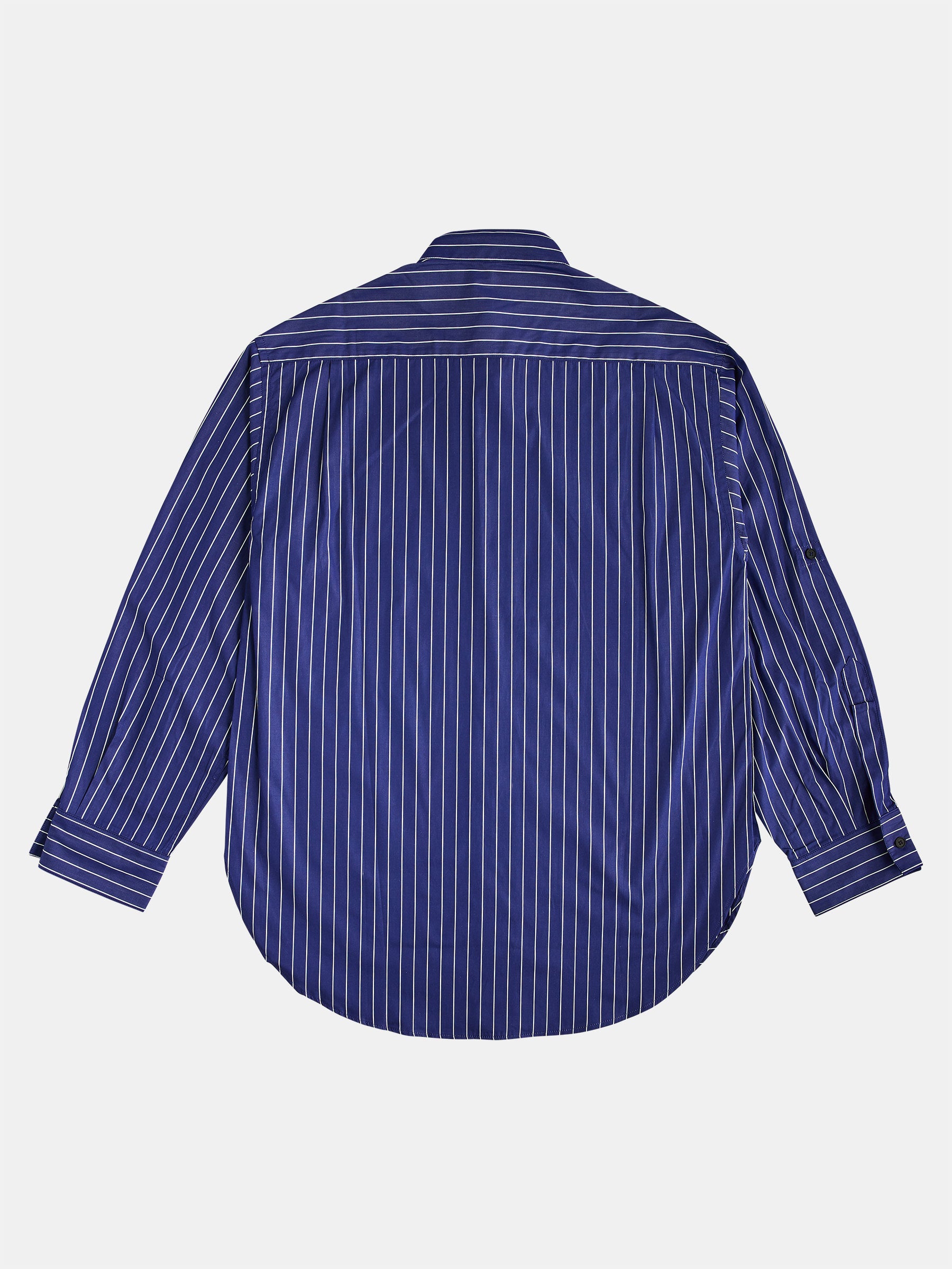 The Oversize Mao Collar Shirt Navy with White Pinstripes by gabrielstunz is laid flat on a white background, showcasing its relaxed oversized fit and buttoned cuffs. The luxury fabric and mao collar add an elegant touch to this chic garment.