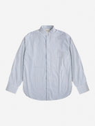 The gabrielstunz Oversized Mandarin Collar Shirt is crafted from 100% Cottonificio Albini fabric and showcases sleek, thin vertical blue stripes against a white background. This long-sleeve button-up piece boasts elegant buttoned cuffs and a stylish silhouette, presented on a plain white backdrop.